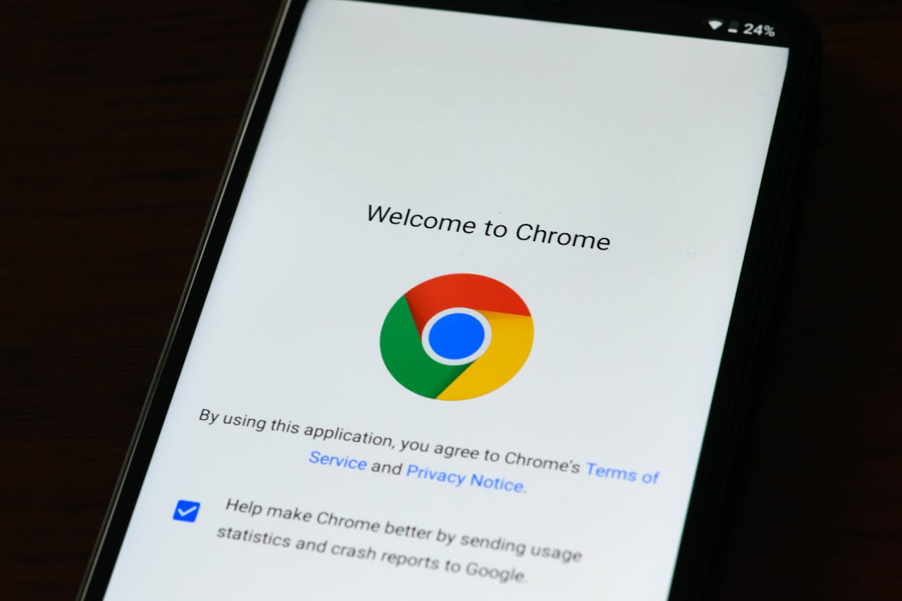 Close-up of smartphone displaying Google Chromes welcome page and logo.